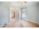Bright bedroom with light blue walls, hardwood floors, and a window for natural light at 22 E Bayaud Ave, Denver, CO 80209