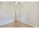 This bedroom features an open doorway to a closet, ceiling fan, and hardwood floors at 22 E Bayaud Ave, Denver, CO 80209