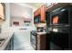Functional kitchen with modern appliances, dark cabinets, and a gas stove, offering efficient cooking space at 22 E Bayaud Ave, Denver, CO 80209