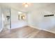 Inviting living room featuring hardwood floors, a pass-through to the kitchen, and modern lighting at 22 E Bayaud Ave, Denver, CO 80209