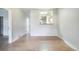 Bright living room with hardwood floors and a pass-through to the kitchen, offering an open and airy feel at 22 E Bayaud Ave, Denver, CO 80209