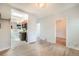 Open concept living room with hardwood floors leading to a kitchen with stainless steel appliances at 22 E Bayaud Ave, Denver, CO 80209