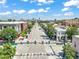 A vibrant city street scene with Denver's skyline in the background, showcasing urban living at 22 E Bayaud Ave, Denver, CO 80209