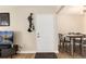The foyer features a coat rack, view of the dining area, and a light-colored interior door at 7665 E Eastman Ave # 107B, Denver, CO 80231