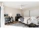 Inviting main bedroom with a ceiling fan, ample closet space, and natural light at 7665 E Eastman Ave # 107B, Denver, CO 80231