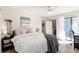 Spacious main bedroom with balcony access, ceiling fan, and lots of light at 7665 E Eastman Ave # 107B, Denver, CO 80231
