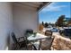 Back patio featuring seating and close proximity to parking and exterior walkway at 7665 E Eastman Ave # 107B, Denver, CO 80231