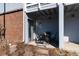 Patio features seating and sliding glass door entrance to the home at 7665 E Eastman Ave # 107B, Denver, CO 80231