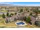 Aerial view of a condo complex with a pool, landscaping, and mountain views at 695 Manhattan Dr # 5, Boulder, CO 80303