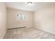 Neutral-toned carpeted bedroom with a window, bathed in soft, natural light at 695 Manhattan Dr # 5, Boulder, CO 80303