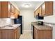 Efficient kitchen with stainless steel appliances and wood cabinets providing ample storage at 695 Manhattan Dr # 5, Boulder, CO 80303