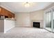 Cozy living room featuring a fireplace, access to a balcony and adjacent breakfast bar area at 695 Manhattan Dr # 5, Boulder, CO 80303