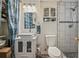 Bathroom featuring a white vessel sink and vanity, a toilet, and tiled shower at 8410 Gray St, Arvada, CO 80003