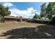Expansive backyard with brick home, mature trees, and privacy fence at 867 S Grape St, Denver, CO 80246