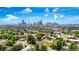 Aerial view of property close to downtown Denver, with city skyline and tree-lined streets at 2737 N Marion St, Denver, CO 80205
