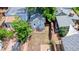 Aerial view of a backyard featuring a level area, fencing, small brick patio, and a gray painted building at 2737 N Marion St, Denver, CO 80205