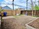 Private backyard with a garden area, brick patio, and wooden fence, perfect for enjoying outdoor living at 2737 N Marion St, Denver, CO 80205