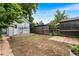 Backyard featuring a level area with a brick pathway, fencing, and small brick patio at 2737 N Marion St, Denver, CO 80205