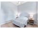 Cozy bedroom with neutral walls, light wood floors, and calming decor at 2737 N Marion St, Denver, CO 80205