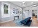 Bright living room with stylish decor, light wood floors, and plenty of natural light at 2737 N Marion St, Denver, CO 80205