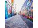 Vibrant street art alleyway showcasing colorful murals and brick-paved walkway with interesting architecture at 2737 N Marion St, Denver, CO 80205