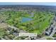 Aerial view of a golf course and the surrounding neighborhood, highlighting the community amenities at 9998 W 70Th Pl, Arvada, CO 80004
