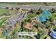 Aerial view of a community park with tennis courts, a playground and a parking lot at 9998 W 70Th Pl, Arvada, CO 80004