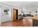 View of the basement featuring a wet bar, egress door, and rec space with couch at 9998 W 70Th Pl, Arvada, CO 80004
