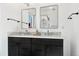 Modern bathroom with double vanity and granite countertops at 9998 W 70Th Pl, Arvada, CO 80004