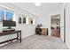 Bedroom with neutral carpet, desk and chair, and windows with a view of the yard at 9998 W 70Th Pl, Arvada, CO 80004