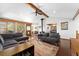 Inviting living room with a vaulted ceiling, hardwood floors, and an abundance of natural light at 9998 W 70Th Pl, Arvada, CO 80004