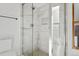 Bright shower with white marble and glass door at 9998 W 70Th Pl, Arvada, CO 80004