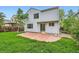 A patio extends from the back of the house, creating an inviting outdoor space for relaxation or entertaining at 1842 Reliance Cir, Superior, CO 80027