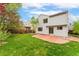 Well maintained lawn with red brick patio and mature landscaping at 1842 Reliance Cir, Superior, CO 80027