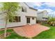 Well maintained lawn with red brick patio and mature landscaping at 1842 Reliance Cir, Superior, CO 80027