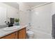 Bright bathroom with a tub and shower combination and a vanity with marble countertop at 1842 Reliance Cir, Superior, CO 80027