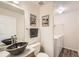 Modern bathroom with unique stone sink, decorative mirror, and in-unit laundry at 1842 Reliance Cir, Superior, CO 80027