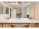 Bathroom features double vanity and large mirror providing lots of light at 1842 Reliance Cir, Superior, CO 80027