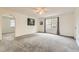 Spacious bedroom features plush carpet, arched doorway, and natural light at 1842 Reliance Cir, Superior, CO 80027