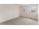 Carpeted bedroom offers a sunny window and neutral walls ready for personalization at 1842 Reliance Cir, Superior, CO 80027