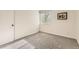 This is an empty bedroom featuring neutral paint, carpet, a window, and a white door at 1842 Reliance Cir, Superior, CO 80027