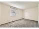 This is a bedroom with a neutral color palette, carpet flooring, and a window at 1842 Reliance Cir, Superior, CO 80027