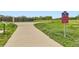 Paved community trail with nearby sign indicating directions to Rock Creek and Community Park at 1842 Reliance Cir, Superior, CO 80027