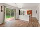 Open dining area with backyard access through sliding glass doors and seamless connection to the living room at 1842 Reliance Cir, Superior, CO 80027