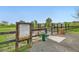 Dog park features rules sign, wood fence, metal gate, dog water fountain and waste station at 1842 Reliance Cir, Superior, CO 80027