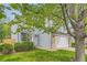 Charming two-story home with light blue siding, brick accents, mature trees, and a well-maintained lawn at 1842 Reliance Cir, Superior, CO 80027