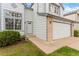 Traditional home featuring a manicured lawn and a two car garage at 1842 Reliance Cir, Superior, CO 80027