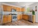 Bright kitchen features stainless steel appliances, light wood cabinets and marbled countertops at 1842 Reliance Cir, Superior, CO 80027