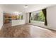 Bright, open-concept layout showcases the kitchen, dining, and living areas with a large window overlooking the backyard at 1842 Reliance Cir, Superior, CO 80027