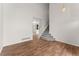 Spacious living room featuring hardwood floors, stairs and chandelier at 1842 Reliance Cir, Superior, CO 80027